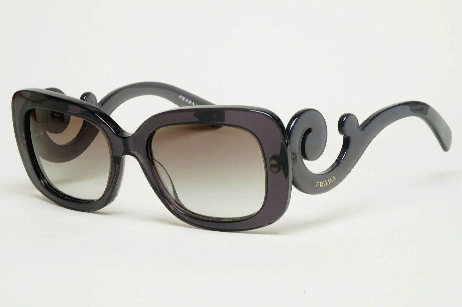 Prada Baroque Sunglasses PR27OS KAM0A7 54mm Transparent Grey/Grey Gradient Lens