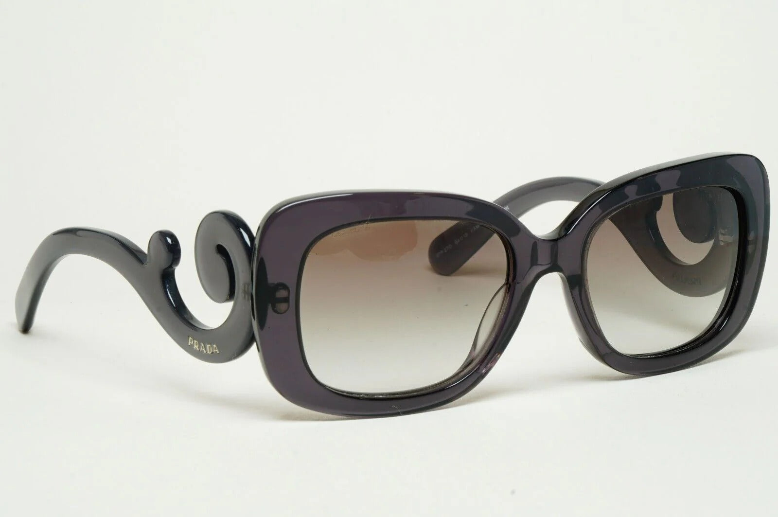 Prada Baroque Sunglasses PR27OS KAM0A7 54mm Transparent Grey/Grey Gradient Lens