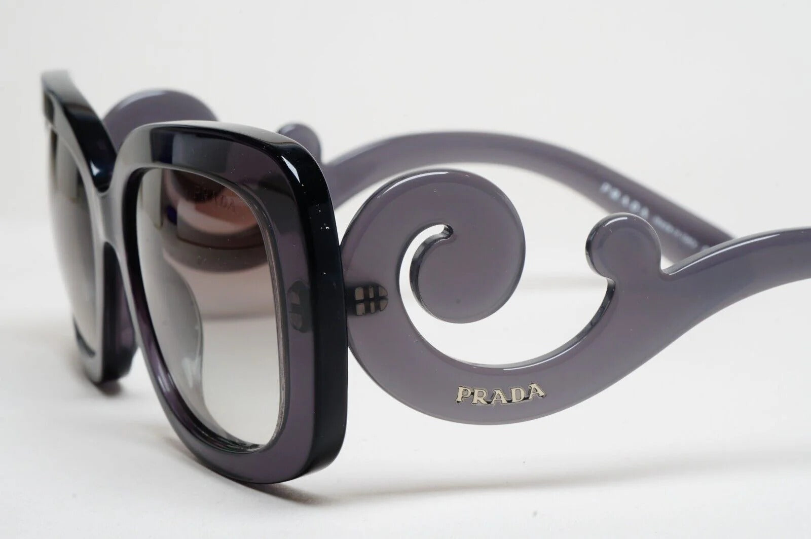 Prada Baroque Sunglasses PR27OS KAM0A7 54mm Transparent Grey/Grey Gradient Lens